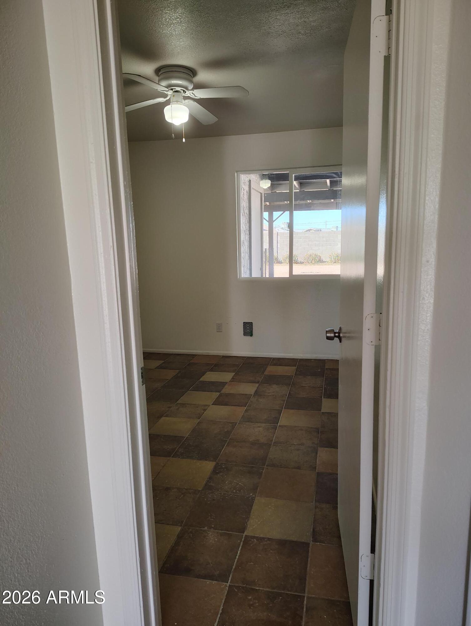 2560 South Yavapai Road Apache Junction, AZ 85119 - Photo 19 of 31 a bathroom with a light fixture and a shower
