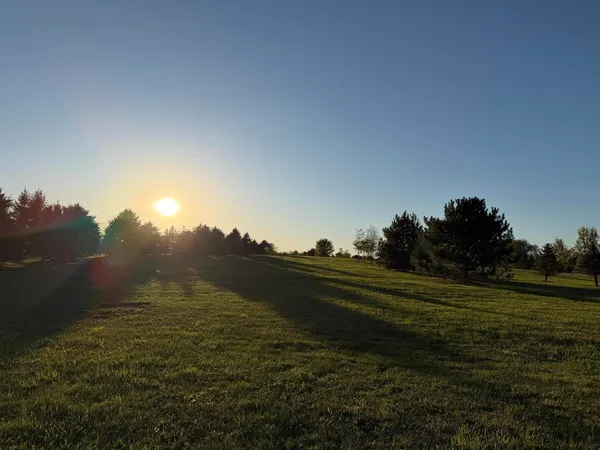 a view of a golf course with a lake