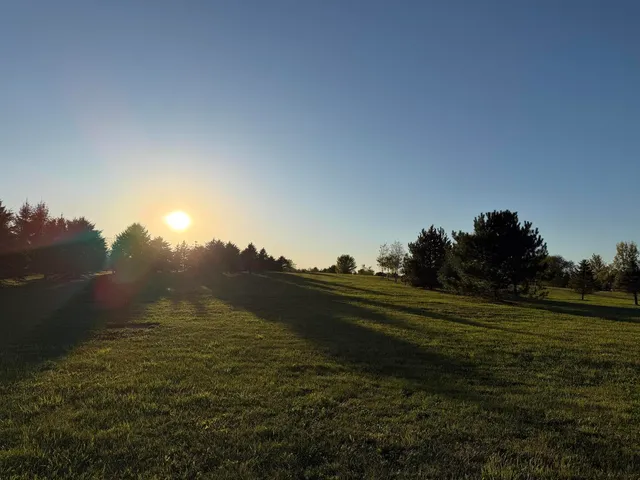 a view of a golf course with a lake