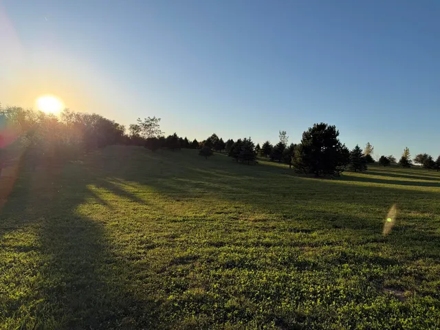 a view of a golf course with a lake