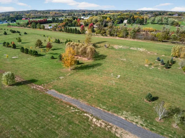 a view of a field with an ocean