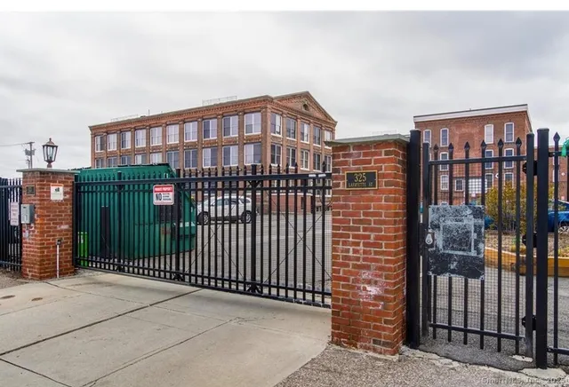 a view of a brick building from the balcony