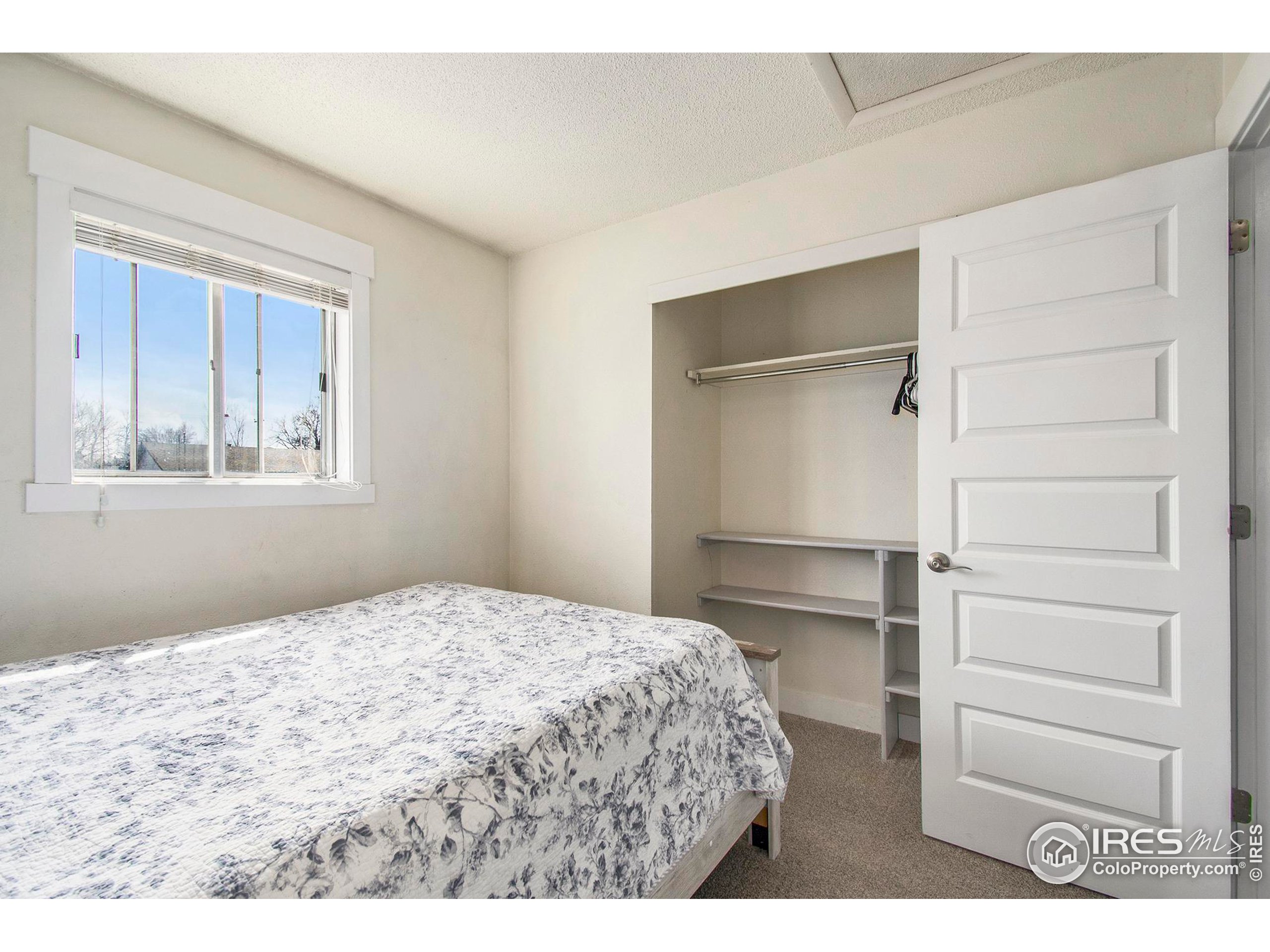3231 West 5th St Road Greeley, CO 80634 - Photo 12 of 31 a bedroom with a bed and a window