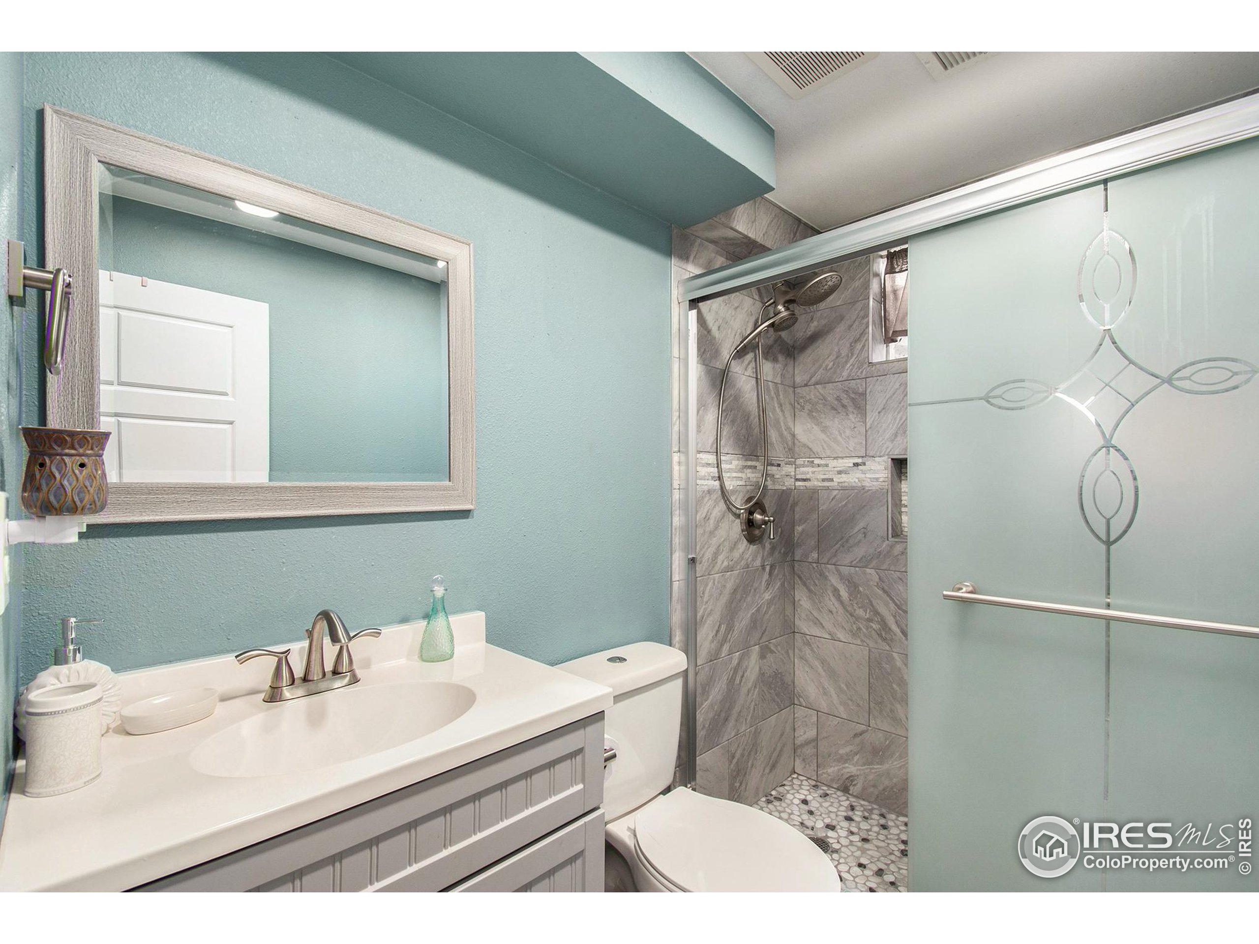3231 West 5th St Road Greeley, CO 80634 - Photo 21 of 31 a bathroom with a sink and a mirror