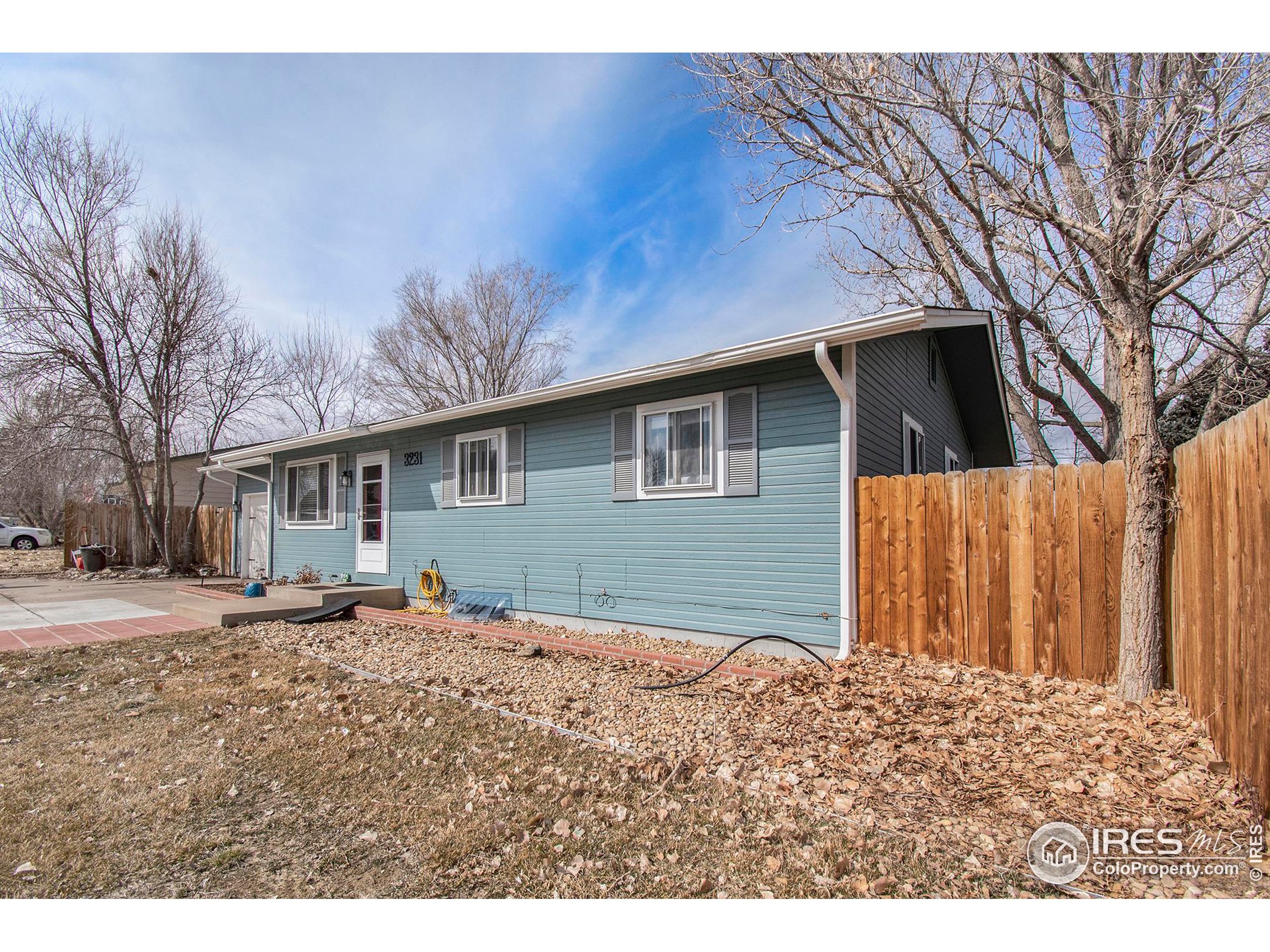 3231 West 5th St Road Greeley, CO 80634 - Photo 3 of 31 a backyard of a house with yard and tree