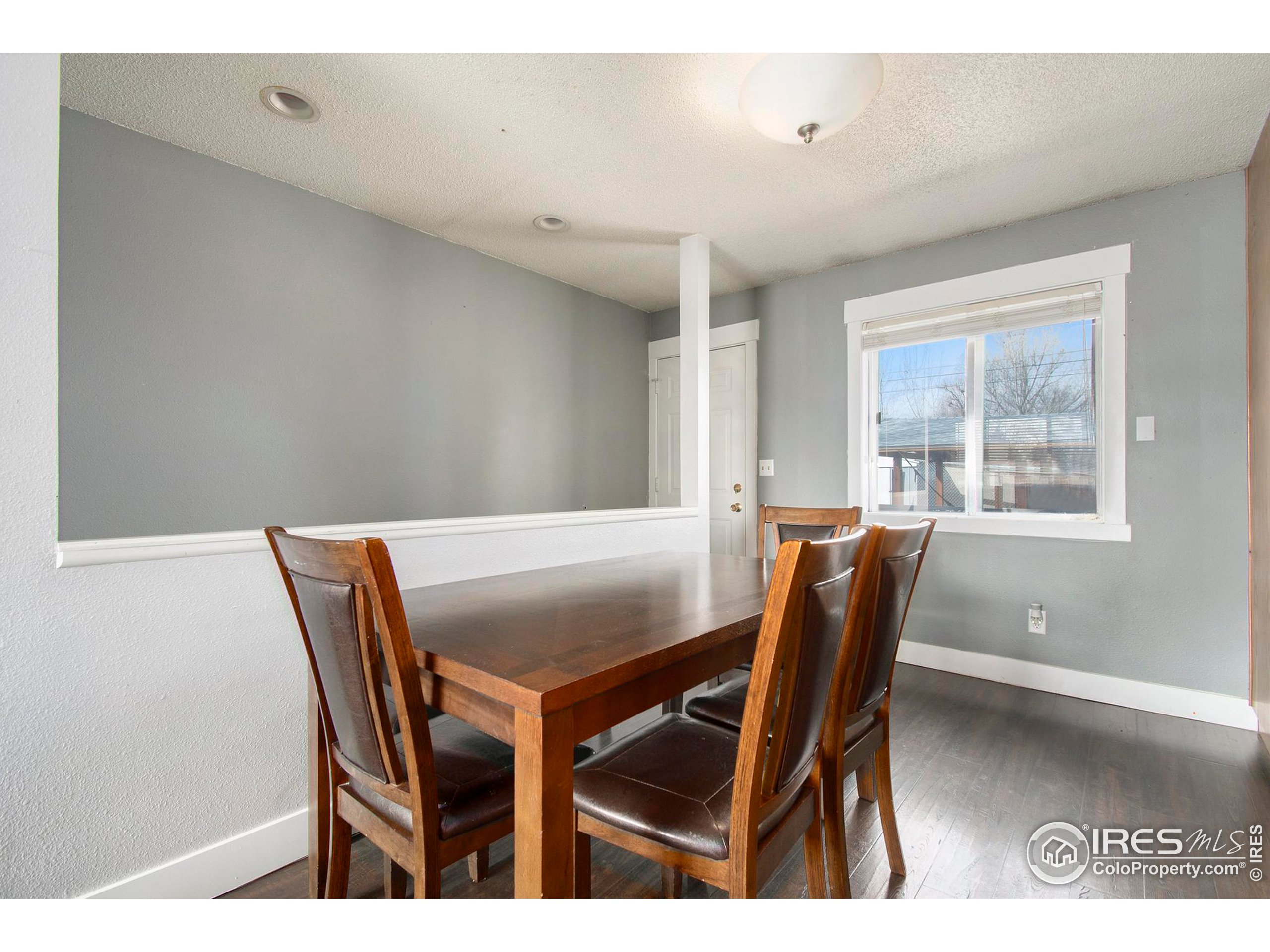 3231 West 5th St Road Greeley, CO 80634 - Photo 9 of 31 a view of a dining room with furniture and a window