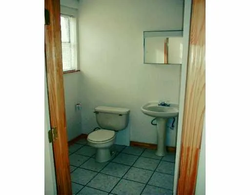 a bathroom with a toilet and a sink