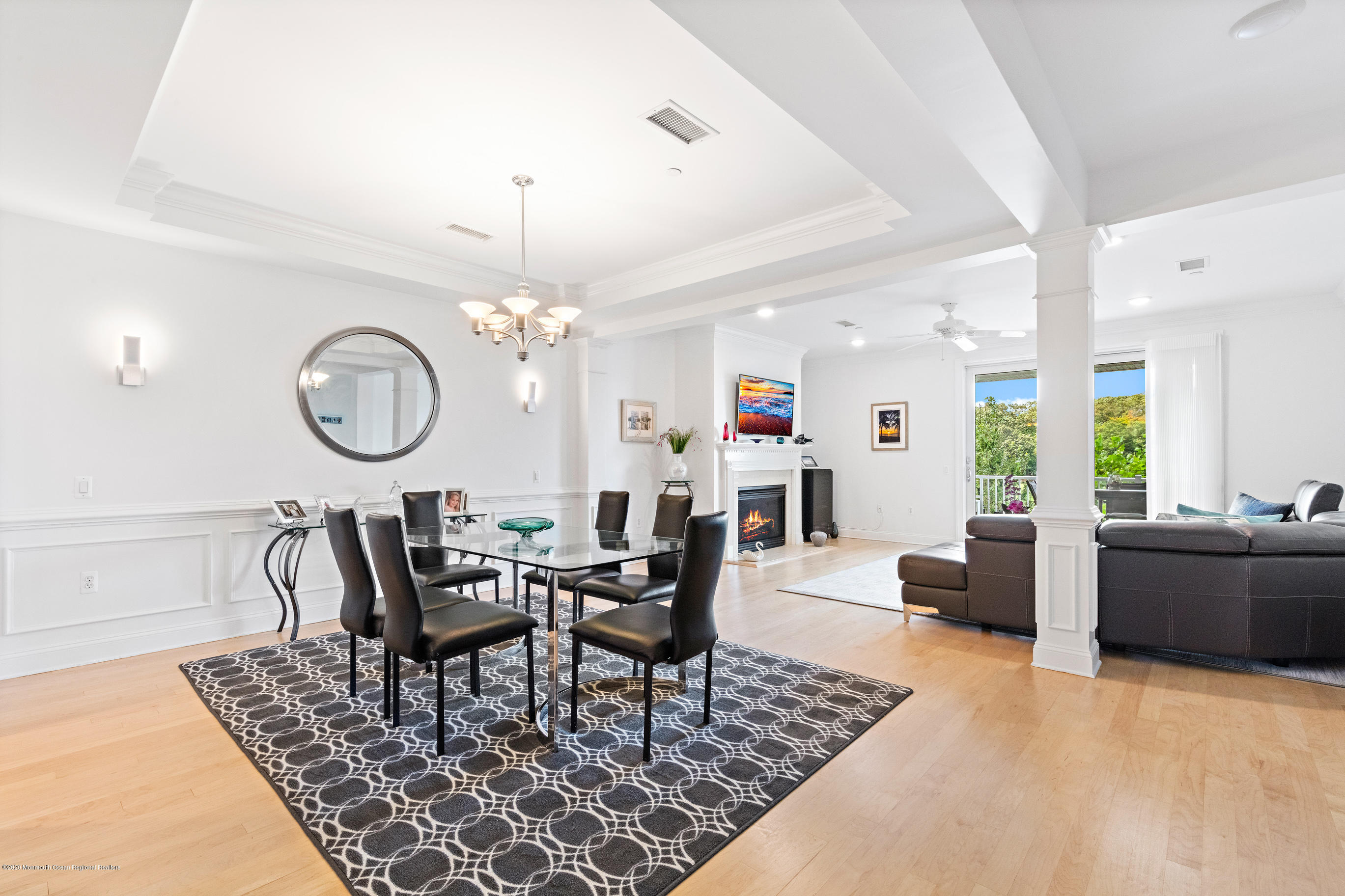 2201 River Road, Unit 1203 Point Pleasant, NJ 08742 - Photo 14 of 51 a view of a dining room with furniture and a chandelier
