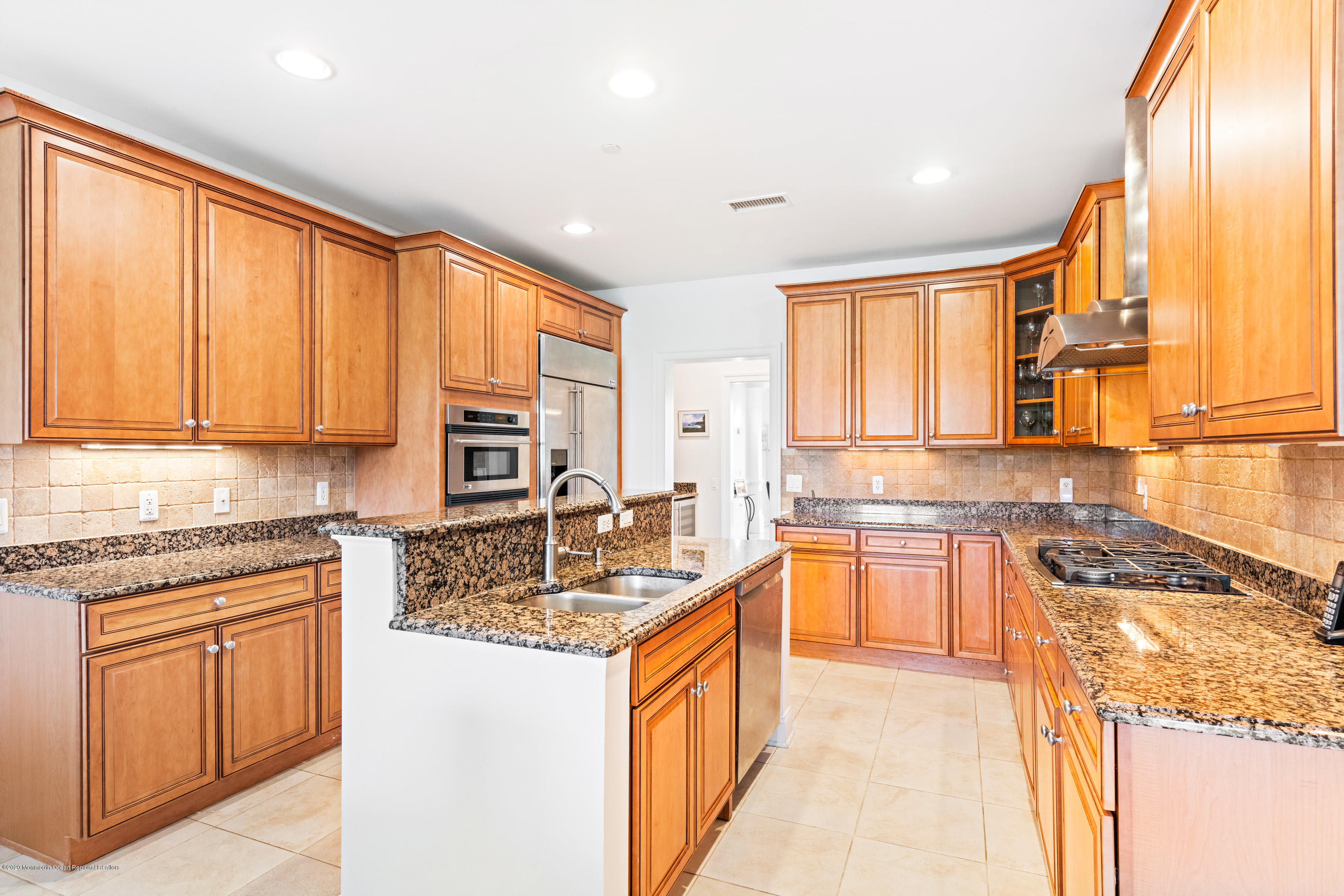 2201 River Road, Unit 1203 Point Pleasant, NJ 08742 - Photo 20 of 51 a kitchen with stainless steel appliances granite countertop sink stove top oven and cabinets