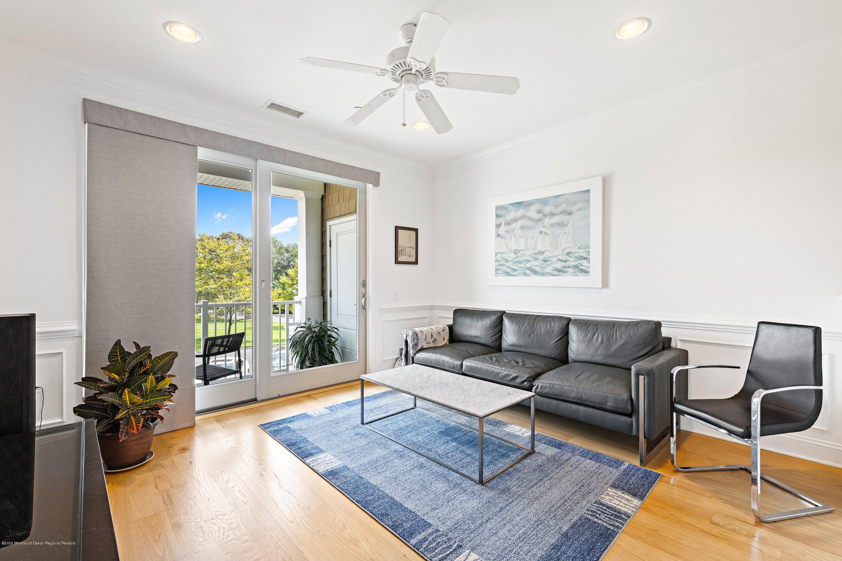 2201 River Road, Unit 1203 Point Pleasant, NJ 08742 - Photo 29 of 51 a living room with furniture and a large window