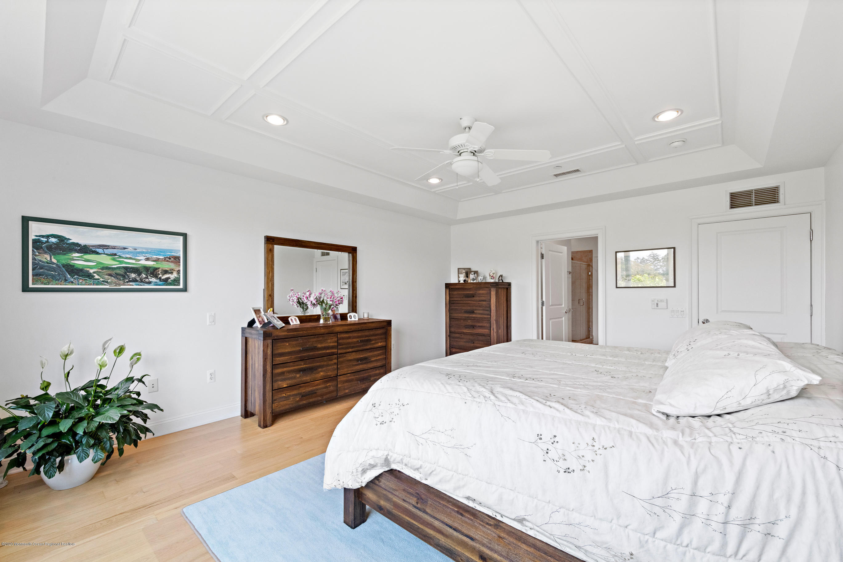 2201 River Road, Unit 1203 Point Pleasant, NJ 08742 - Photo 33 of 51 a spacious bedroom with a bed and a dresser
