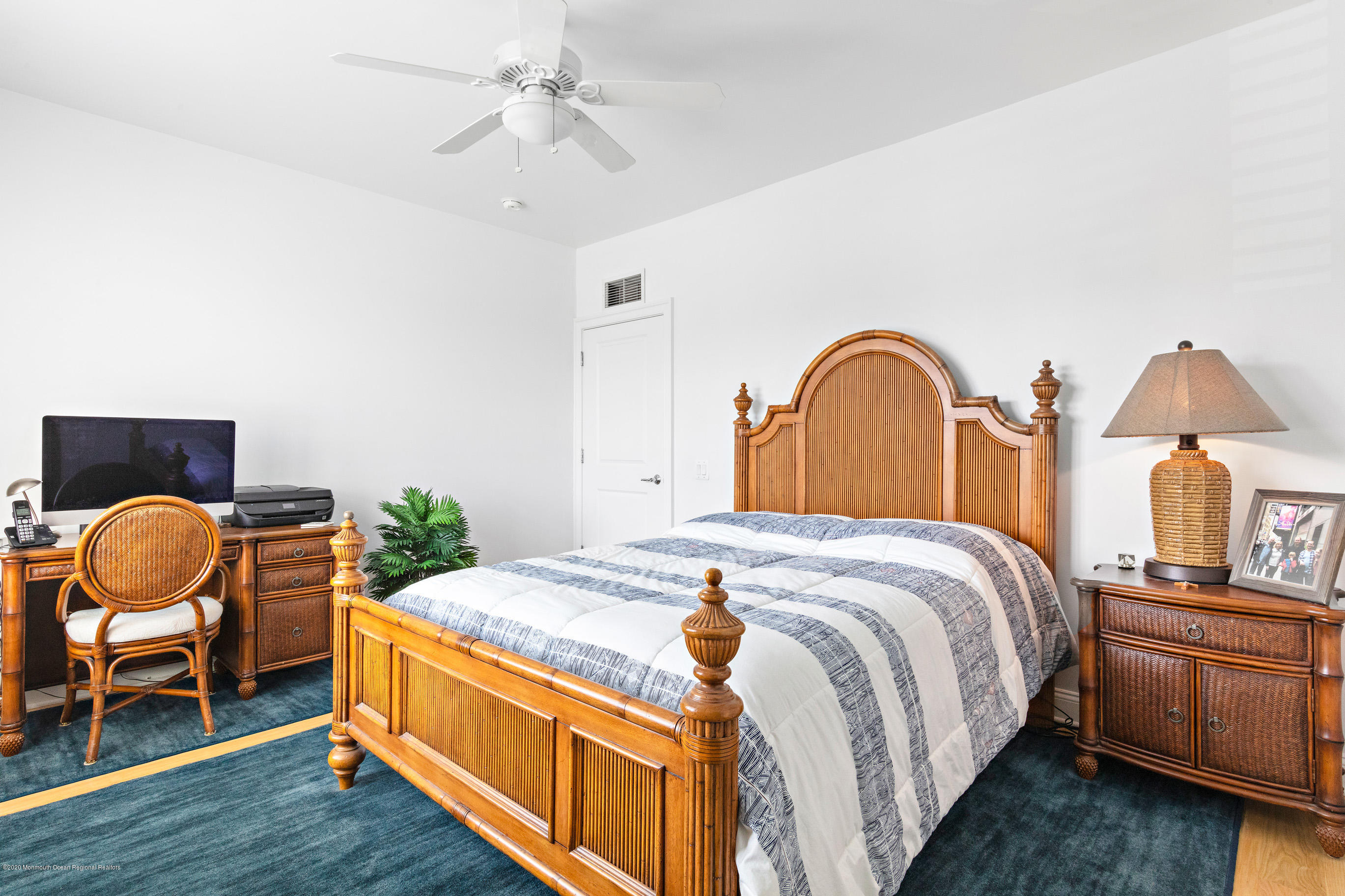 2201 River Road, Unit 1203 Point Pleasant, NJ 08742 - Photo 41 of 51 a bedroom with bed and chair