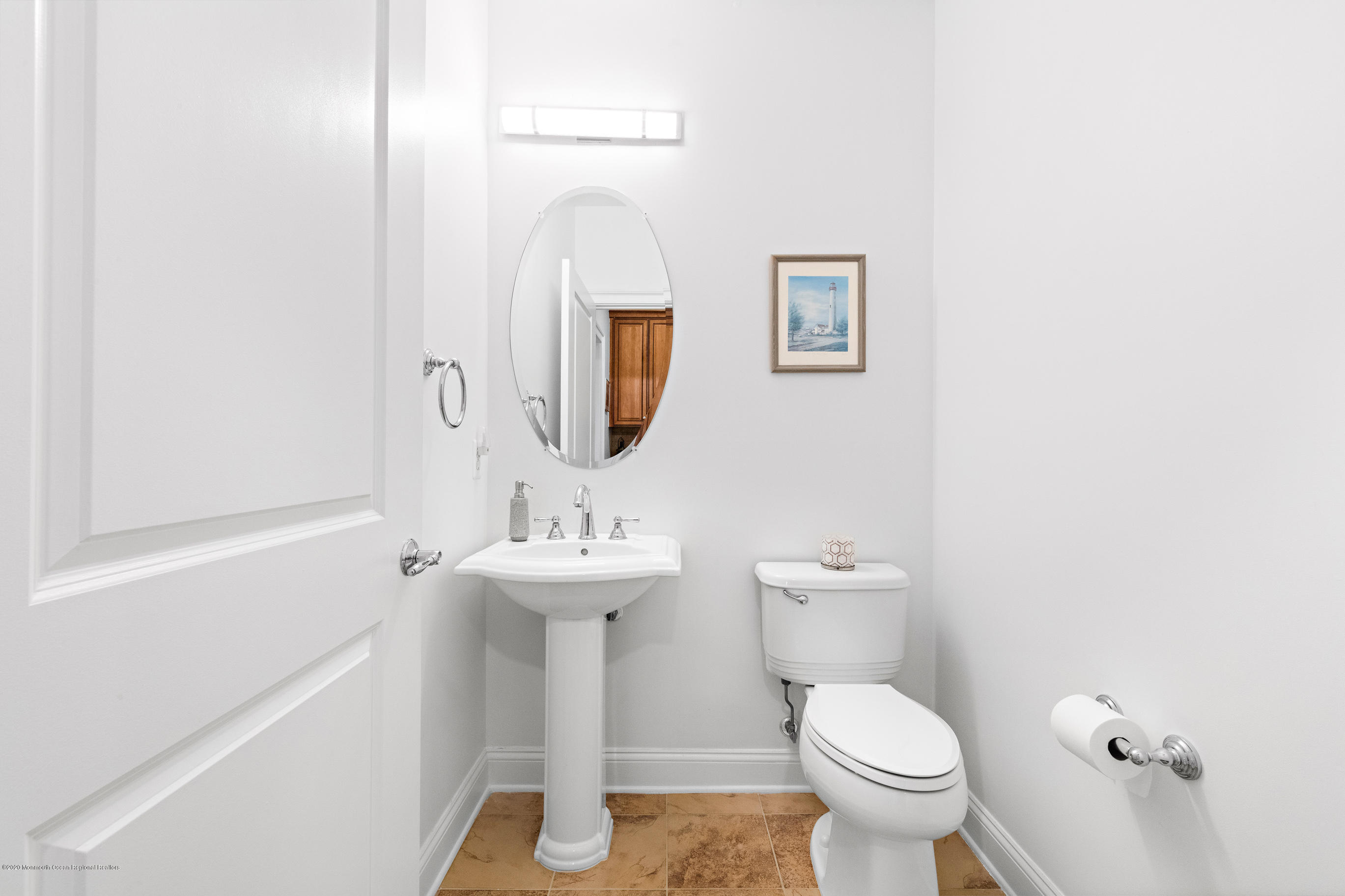 2201 River Road, Unit 1203 Point Pleasant, NJ 08742 - Photo 44 of 51 a bathroom with a toilet sink and mirror