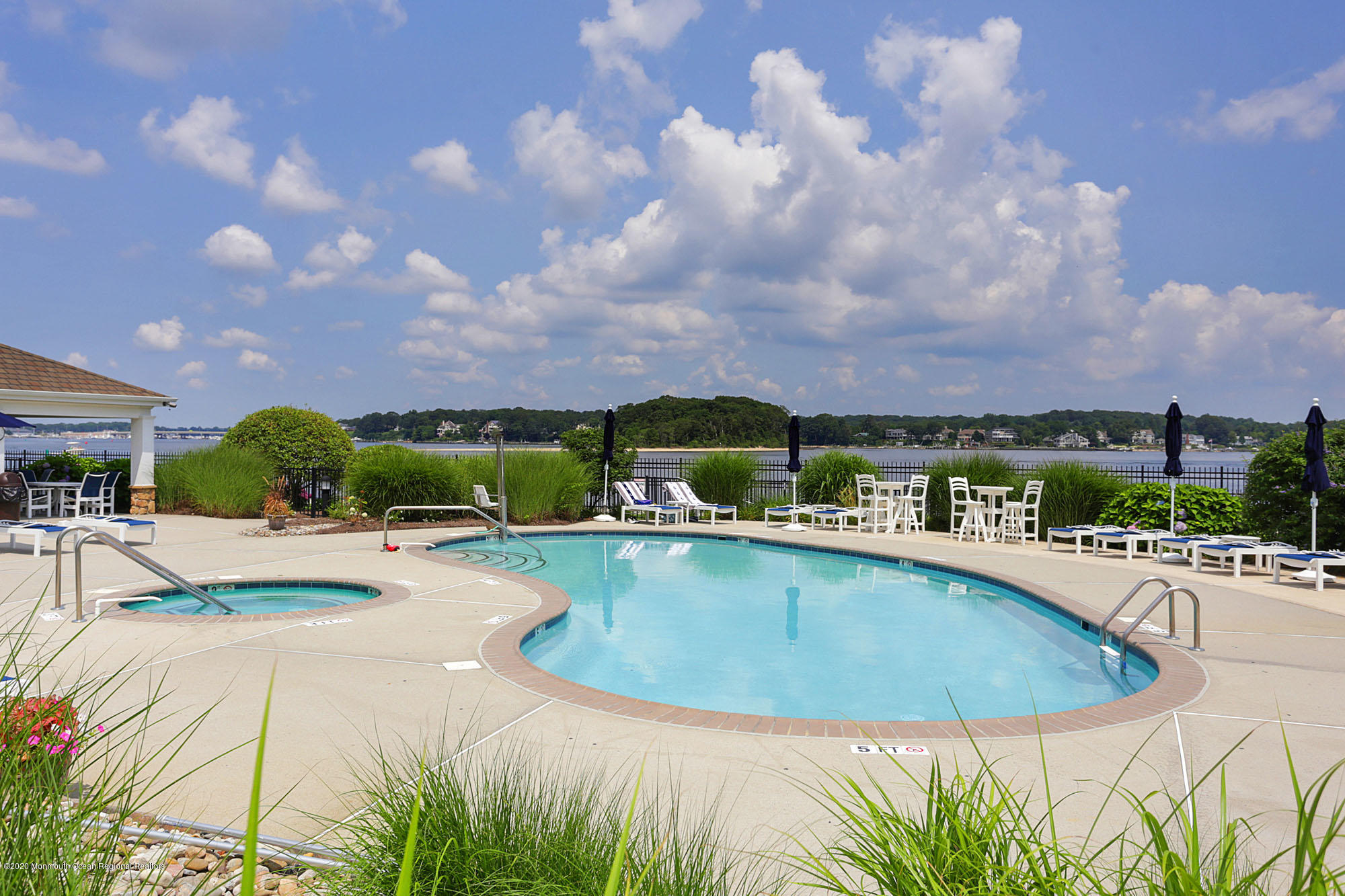 2201 River Road, Unit 1203 Point Pleasant, NJ 08742 - Photo 45 of 51 a view of a swimming pool and lounge chair