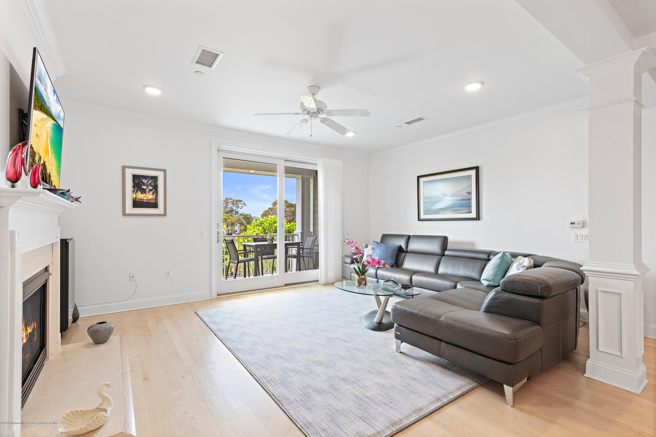 2201 River Road, Unit 1203 Point Pleasant, NJ 08742 - Photo 9 of 51 a living room with furniture and a flat screen tv