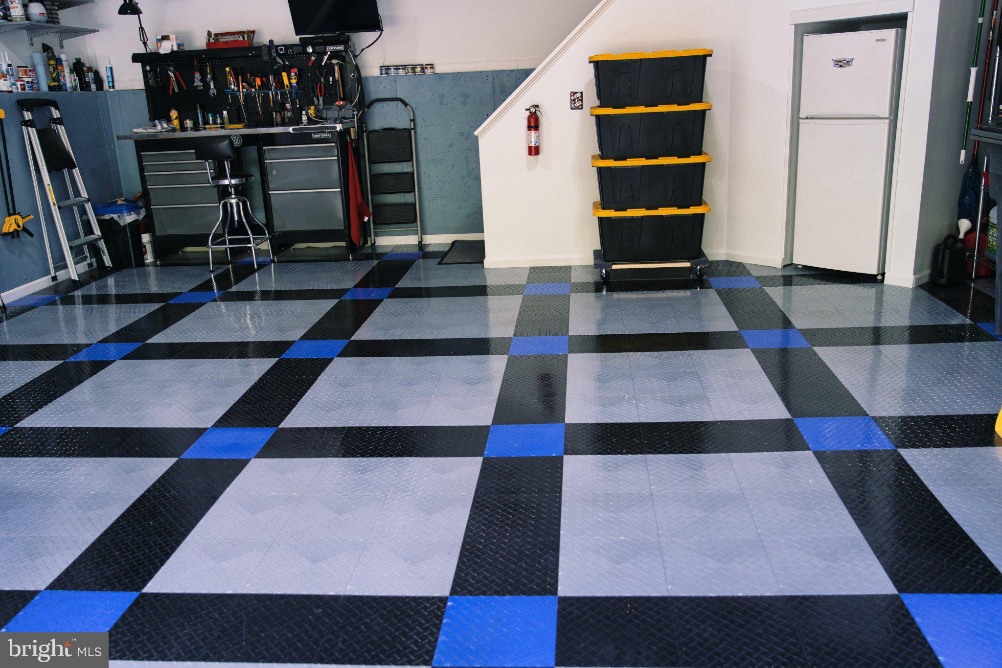 14541 Old Mill Road Centreville, VA 20121 - Photo 105 of 109 Sleek garage with bold floor design.
