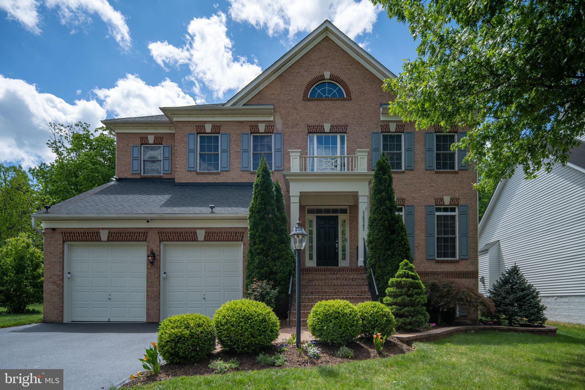 14541 Old Mill Road Centreville, VA 20121 - Photo 2 of 109 Elegant brick home with lush greenery.