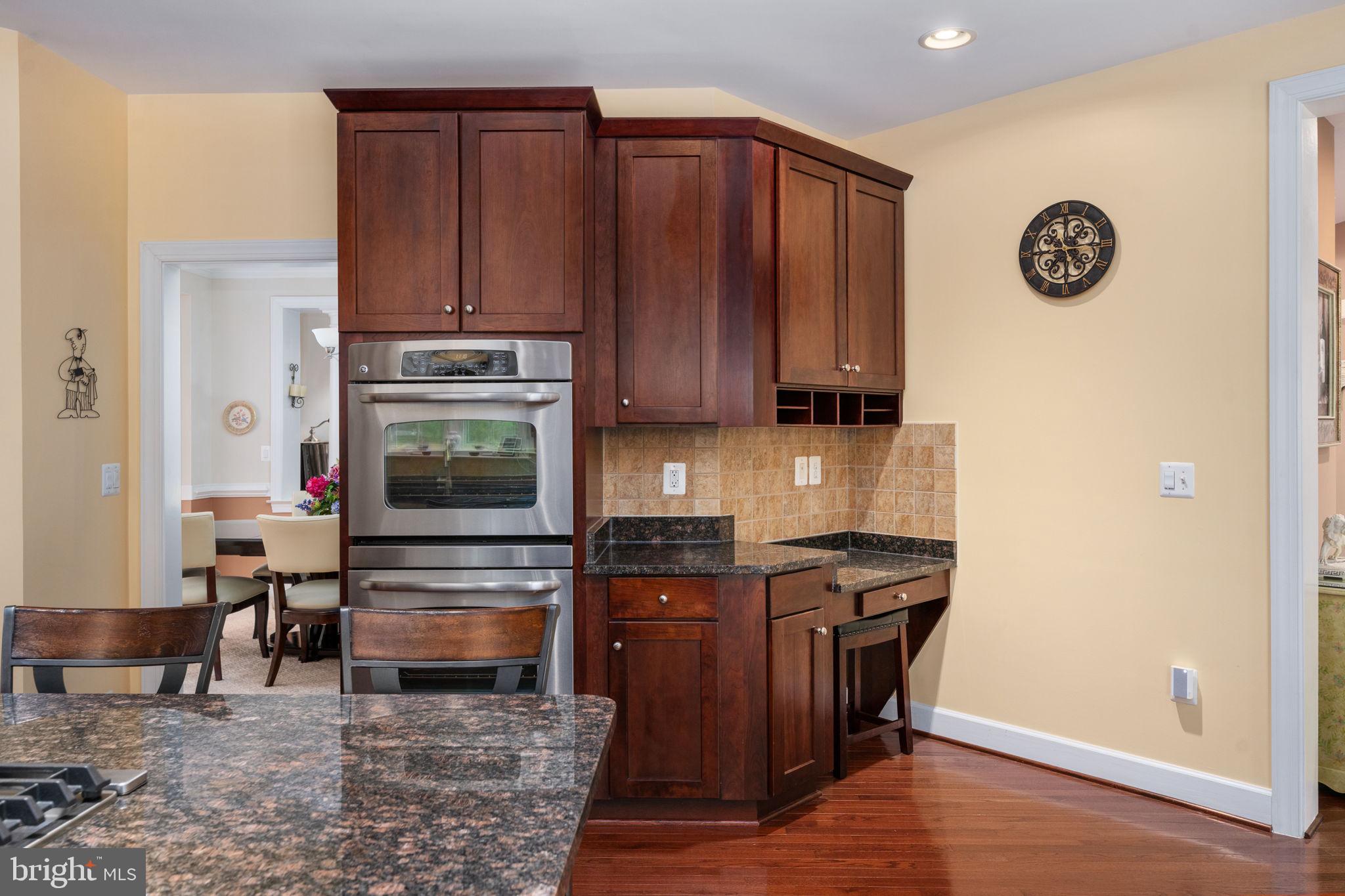 14541 Old Mill Road Centreville, VA 20121 - Photo 36 of 109 Elegant kitchen with rich cabinetry.