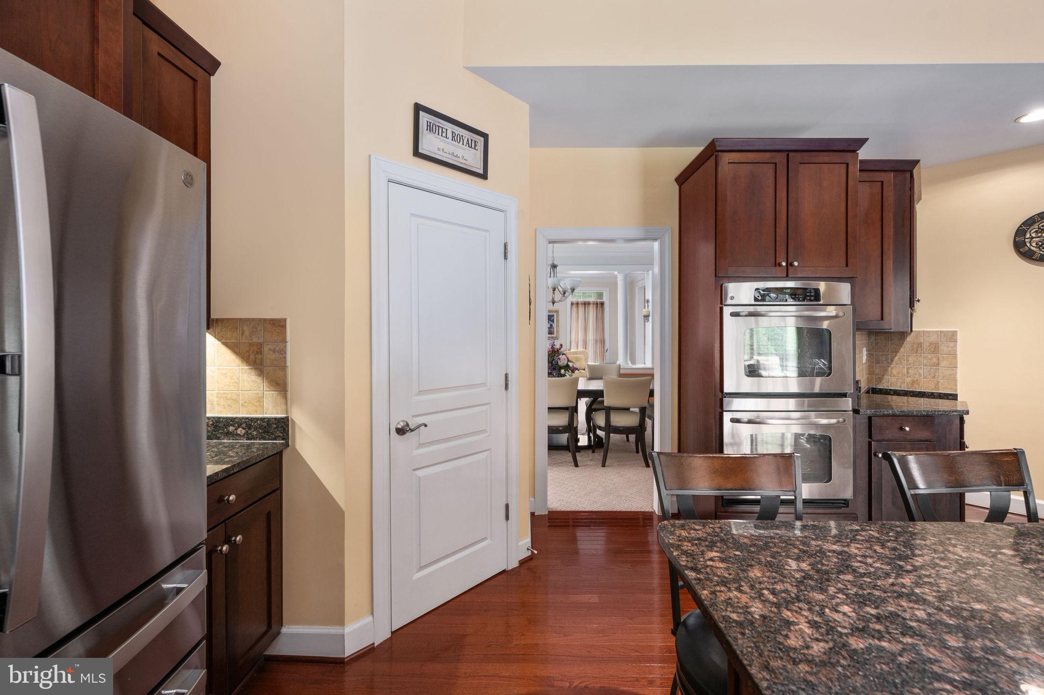 14541 Old Mill Road Centreville, VA 20121 - Photo 38 of 109 Modern kitchen with rich wood accents.