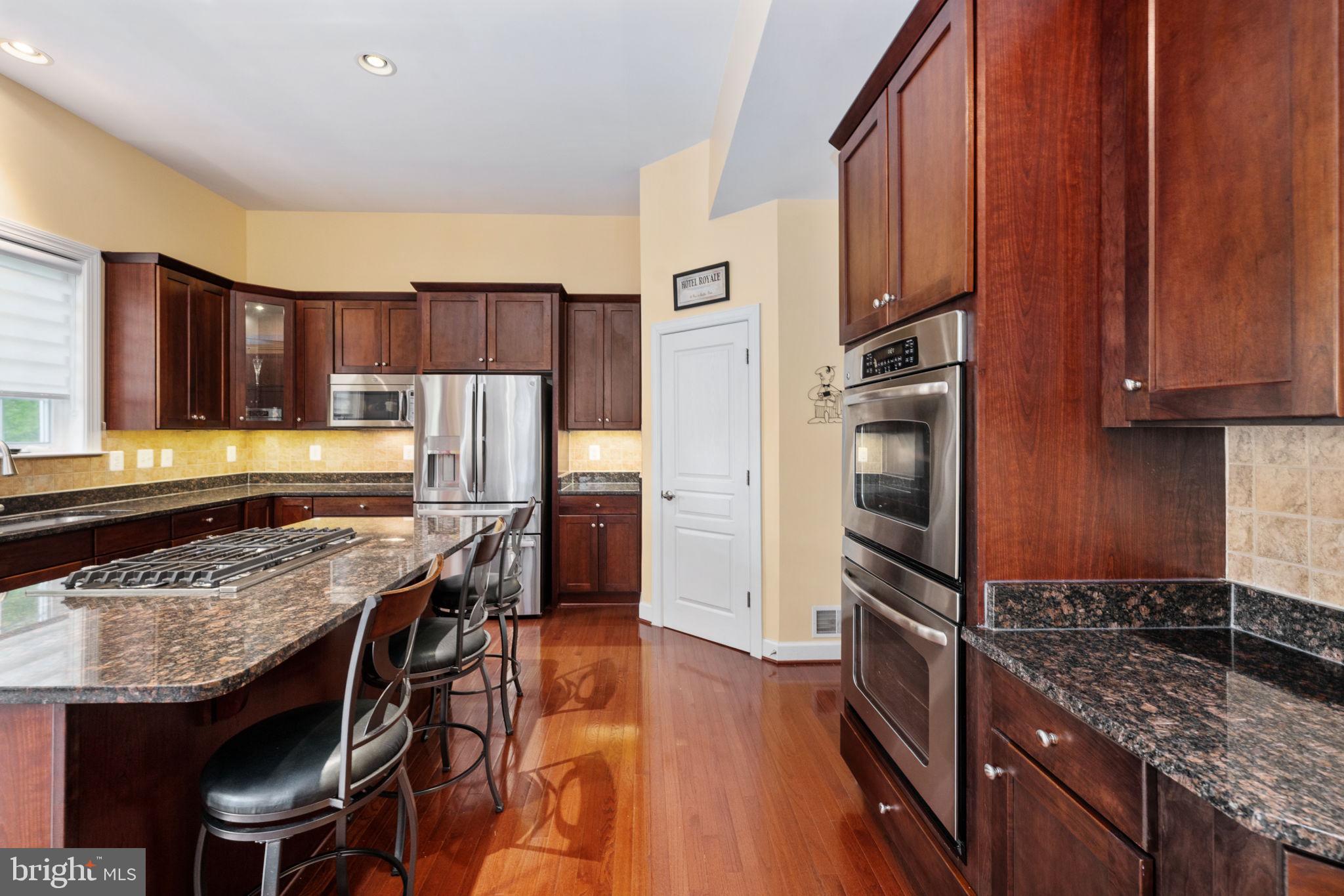 14541 Old Mill Road Centreville, VA 20121 - Photo 42 of 109 Elegant kitchen with rich cabinetry.