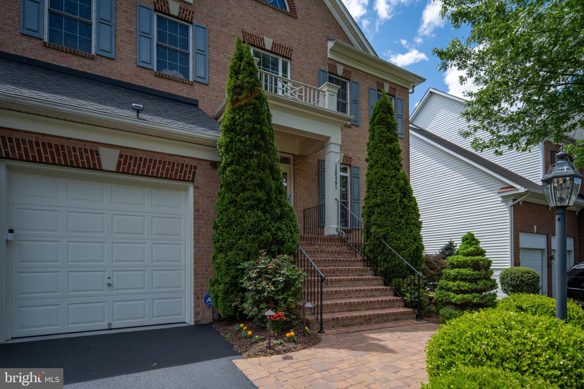 14541 Old Mill Road Centreville, VA 20121 - Photo 6 of 109 Elegant entrance with lush greenery.
