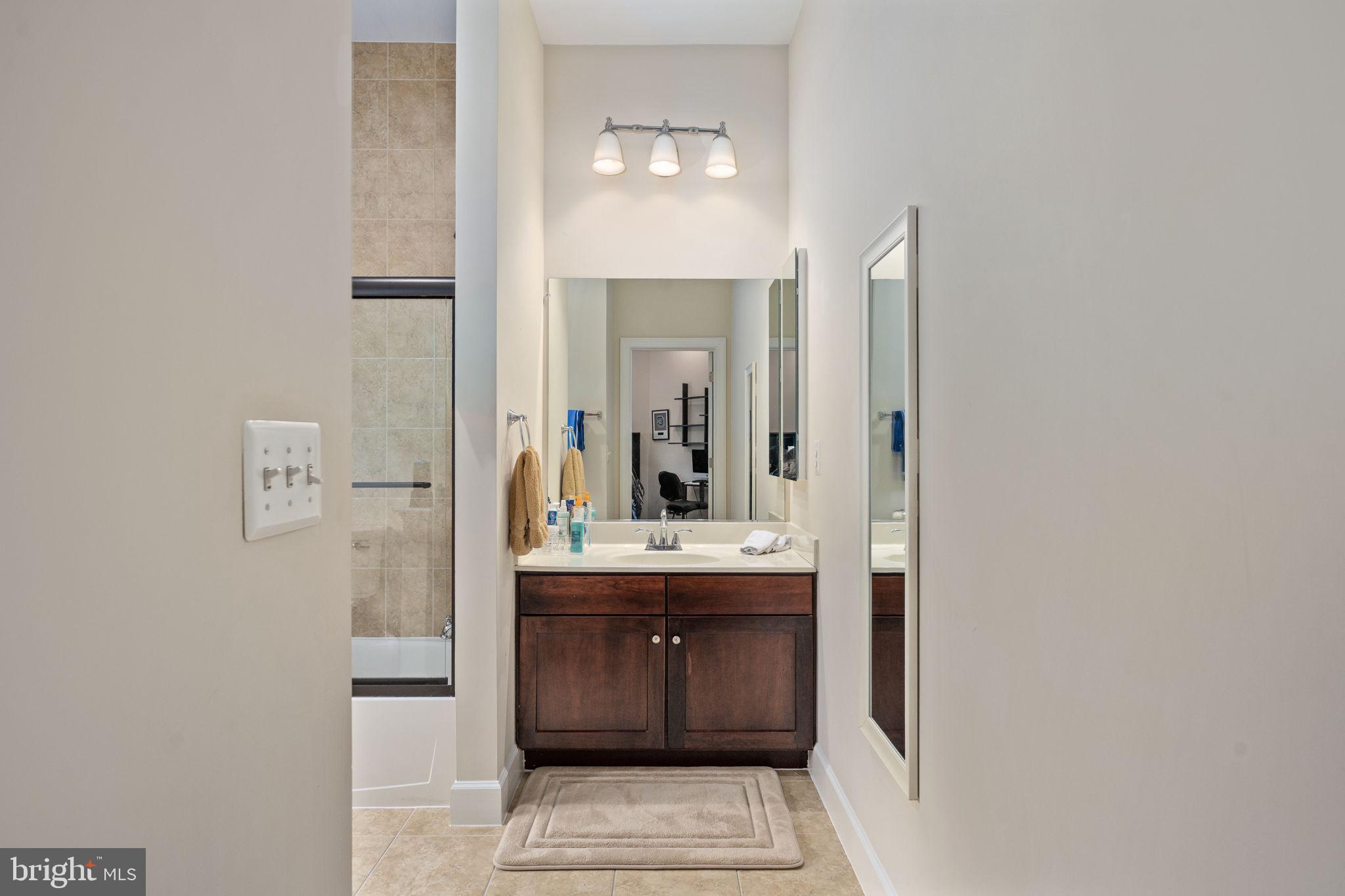 14541 Old Mill Road Centreville, VA 20121 - Photo 64 of 109 Sleek modern bathroom with elegance.