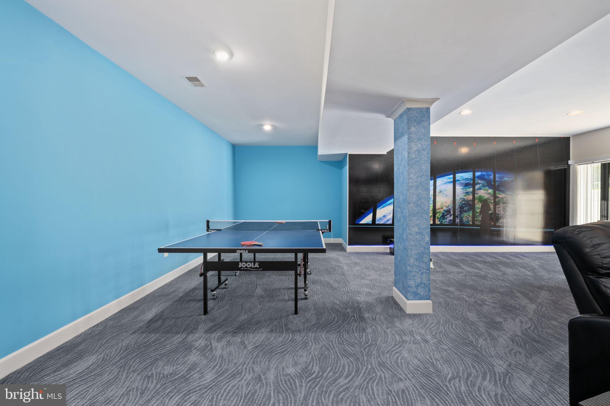14541 Old Mill Road Centreville, VA 20121 - Photo 82 of 109 Vibrant game room with blue accents.