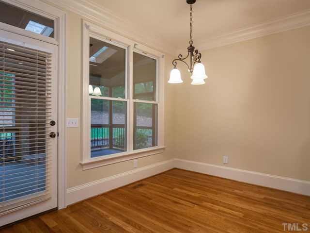 12816 River Dance Drive Raleigh, NC 27613 - Photo 13 of 25 The freshly painted breakfast room features hardwood floors, crown molding, and direct access to the wonderful screen porch.