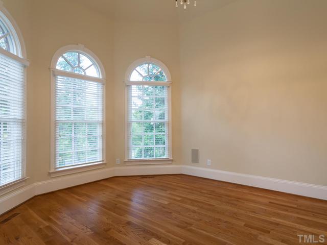 12816 River Dance Drive Raleigh, NC 27613 - Photo 14 of 25 One of the most beautiful rooms on the main level is the first floor study. Special features include 3 windows with palladium arches in a turret setting, an intricate vaulted ceiling that is a work of art, hardwood floors, and distributed audio.