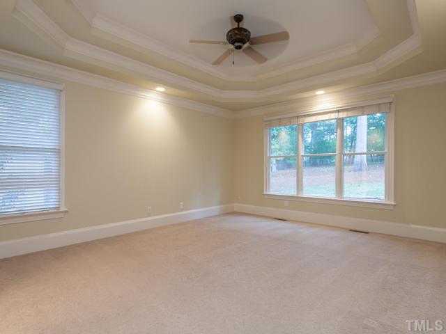 12816 River Dance Drive Raleigh, NC 27613 - Photo 15 of 25 A double trey ceiling crowns the first floor master bedroom ceiling. That freshly-painted master suite offers high-end sculptured carpet, a ceiling fan, plantation blinds and a large walk in closet.