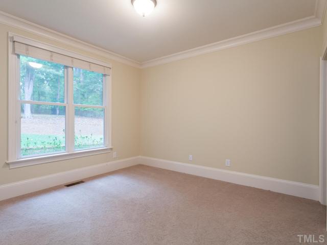 12816 River Dance Drive Raleigh, NC 27613 - Photo 18 of 25 The first floor guest bedroom has direct access to a full bath. Additional features included crown molding, plantation blinds and a wonderful view of the beautiful backyard. This room has been freshly painted and the carpet has been professionally cleaned