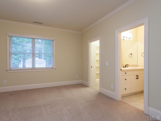 12816 River Dance Drive Raleigh, NC 27613 - Photo 22 of 25 With the exception of the bonus room, all rooms on the second floor directly adjoin a full bath. Each bath features ceramic tile flooring and a tub/shower combination with tile surround. The room featured in this photograph has a large walk-in closet.