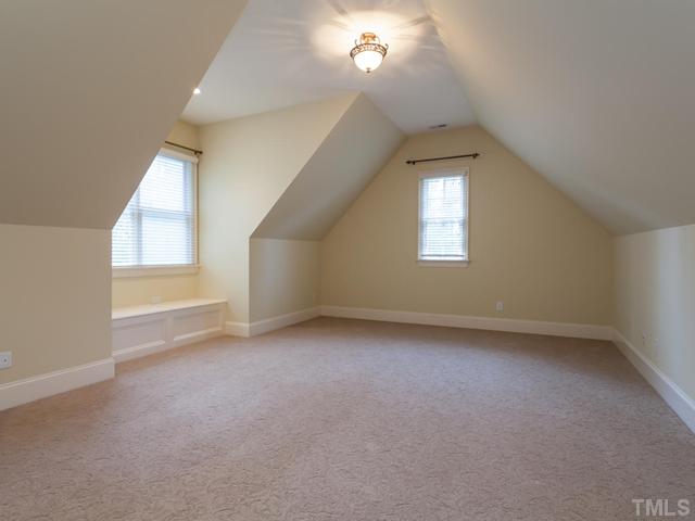 12816 River Dance Drive Raleigh, NC 27613 - Photo 23 of 25 The bonus room has built-in bookshelves for the storage of games and collectibles. This room has been freshly painted and features high-end sculptured carpet that has been professionally cleaned.