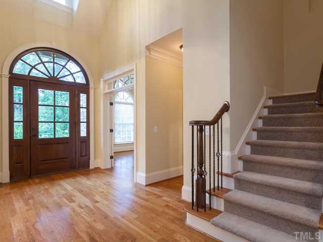 12816 River Dance Drive Raleigh, NC 27613 - Photo 4 of 25 A 2-story foyer welcomes you to this freshly painted home with hardwood floors that flow through the main living areas. Notice the graceful palladium window over the front door.
