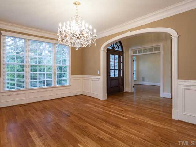 12816 River Dance Drive Raleigh, NC 27613 - Photo 6 of 25 This is a view of the dining room as it opens to the foyer through a stately arched doorway. Notice the intricate craftsmanship around the opening.