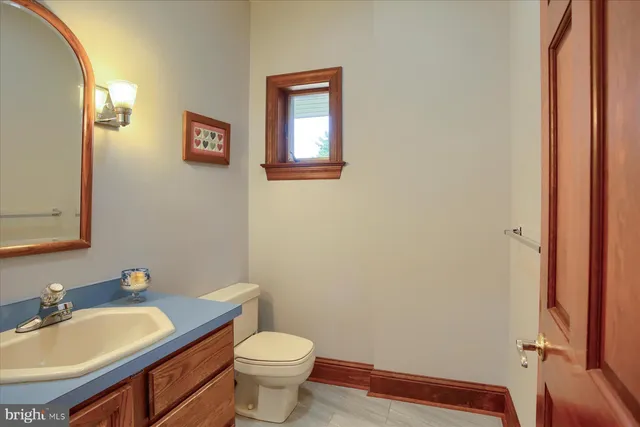 a bathroom with double sink and a mirror