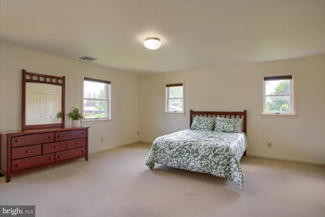 a view of yard with swimming pool and green space