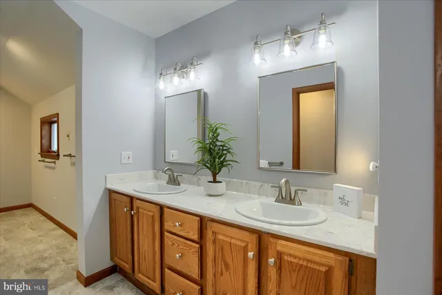 a view of a swimming pool with a lounge chairs in front of building