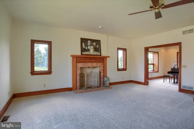 a view of a dining room with furniture wooden floor and chandelier