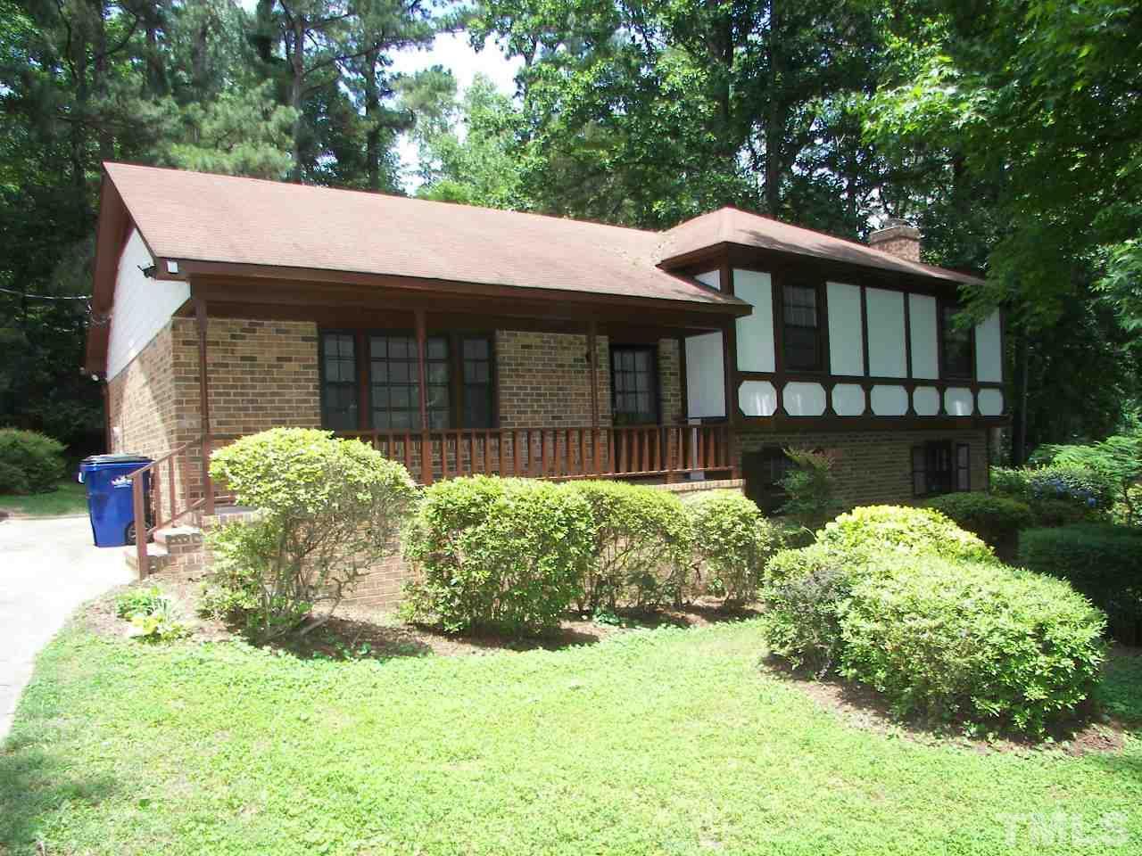 6729 Johnsdale Road Raleigh, NC 27615 - Photo 1 of 25 a front view of a house with garden