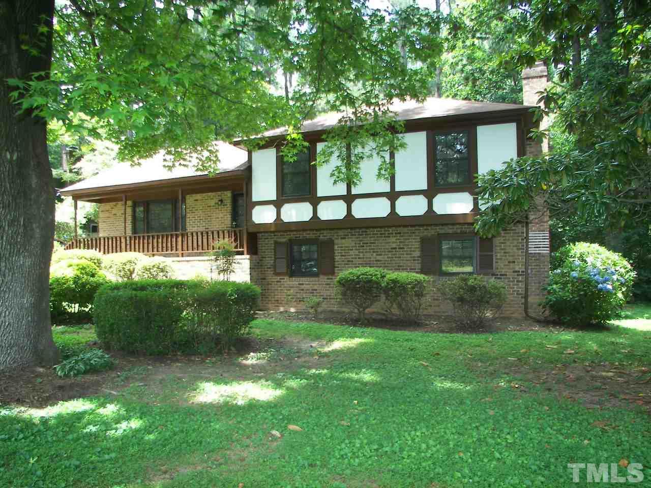 6729 Johnsdale Road Raleigh, NC 27615 - Photo 2 of 25 a view of a house with a yard