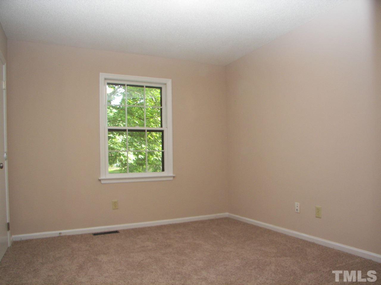 6729 Johnsdale Road Raleigh, NC 27615 - Photo 11 of 25 an empty room with a window