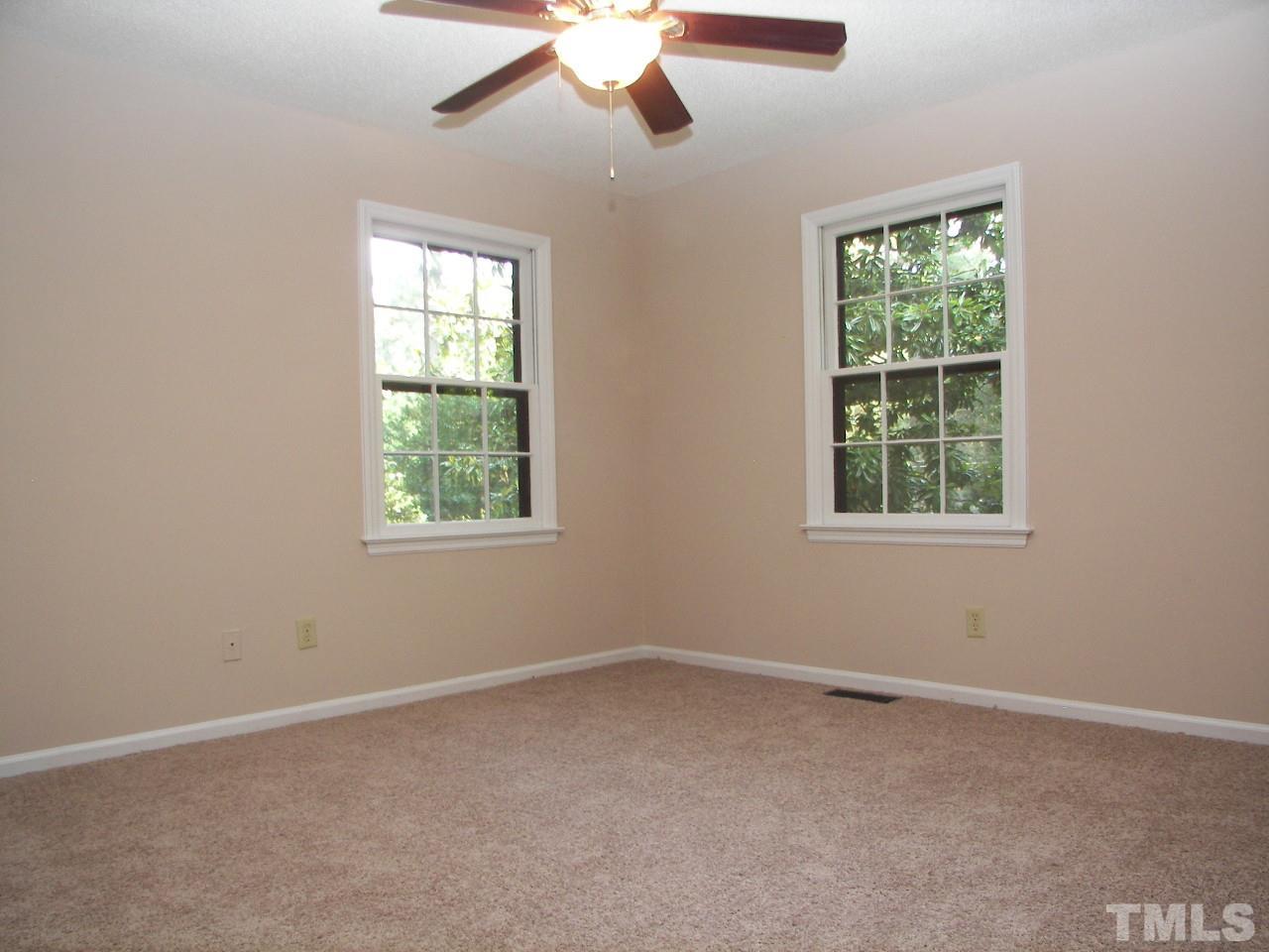 6729 Johnsdale Road Raleigh, NC 27615 - Photo 12 of 25 an empty room with a window and a fan