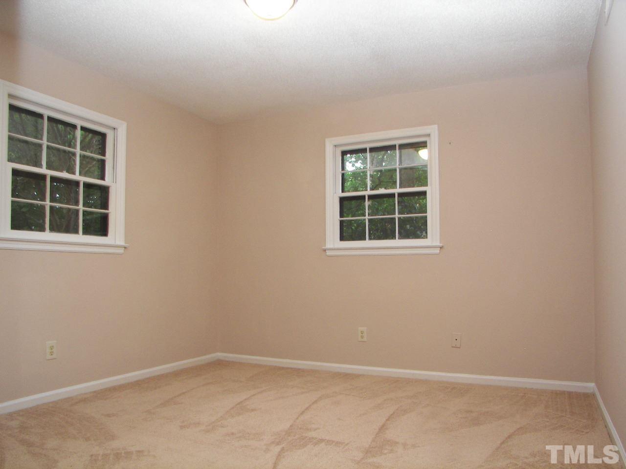 6729 Johnsdale Road Raleigh, NC 27615 - Photo 18 of 25 an empty room with a window