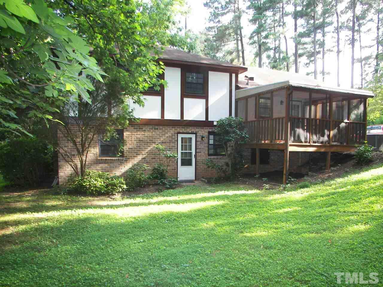 6729 Johnsdale Road Raleigh, NC 27615 - Photo 23 of 25 a view of a house with a yard