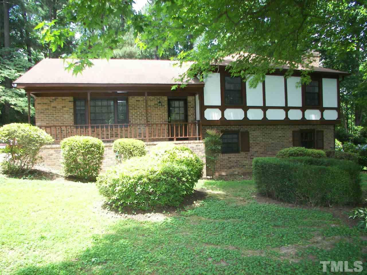 6729 Johnsdale Road Raleigh, NC 27615 - Photo 24 of 25 a front view of a house with garden