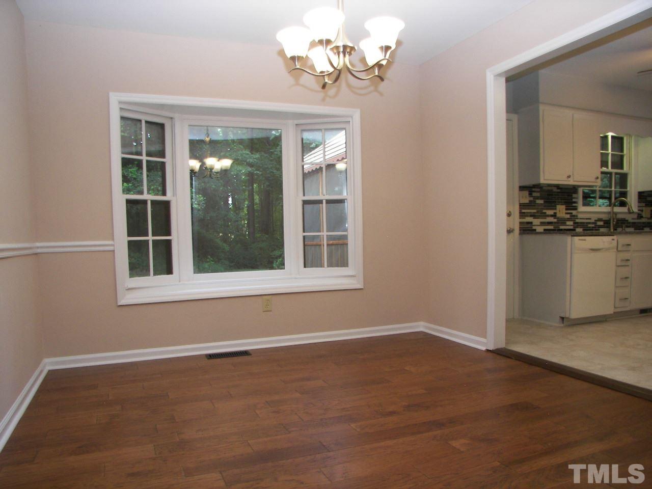 6729 Johnsdale Road Raleigh, NC 27615 - Photo 8 of 25 a view of an empty room with a window