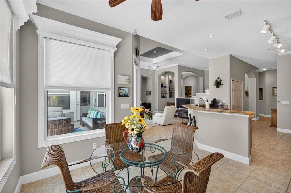 8 Hidden Lake Way Palm Coast, FL 32137 - Photo 12 of 46 a view of a dining room with furniture and window