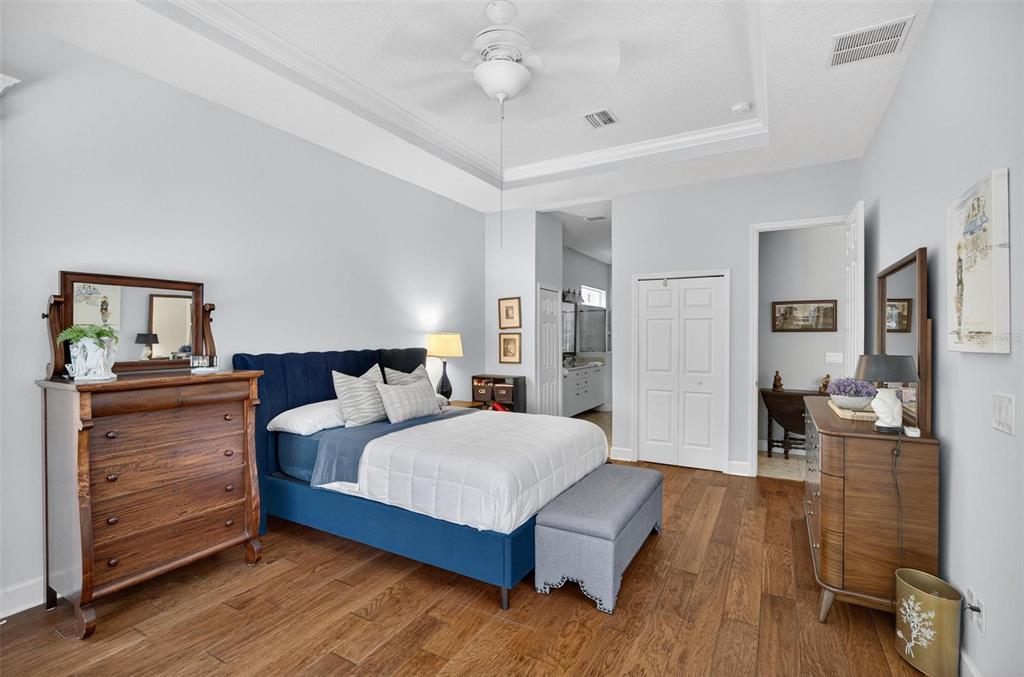 8 Hidden Lake Way Palm Coast, FL 32137 - Photo 24 of 46 a bedroom with a bed and dresser