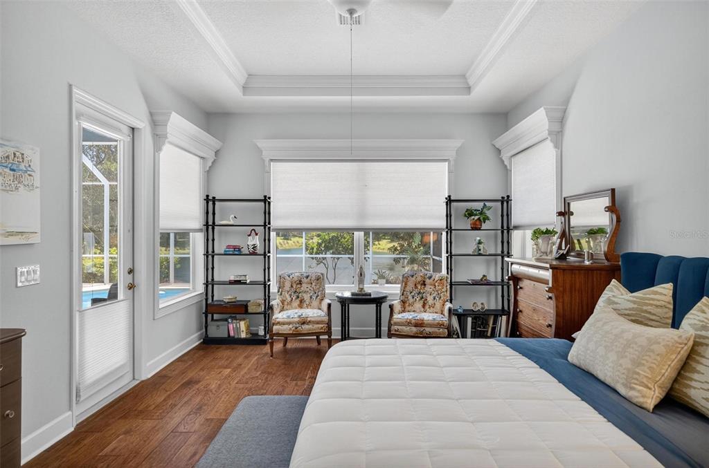 8 Hidden Lake Way Palm Coast, FL 32137 - Photo 25 of 46 a bedroom with a bed furniture and a large window